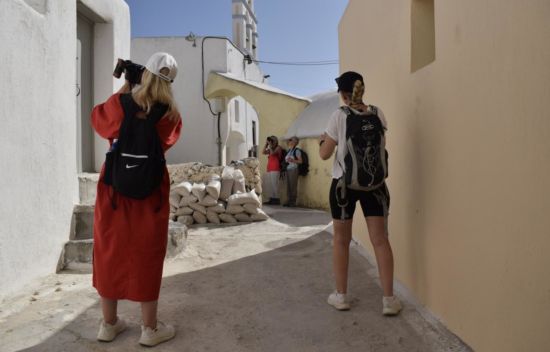 The photography team is photo-exploring Emporio village in Santorini. October 2023